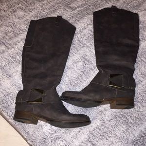 Grey boots a little below the knee